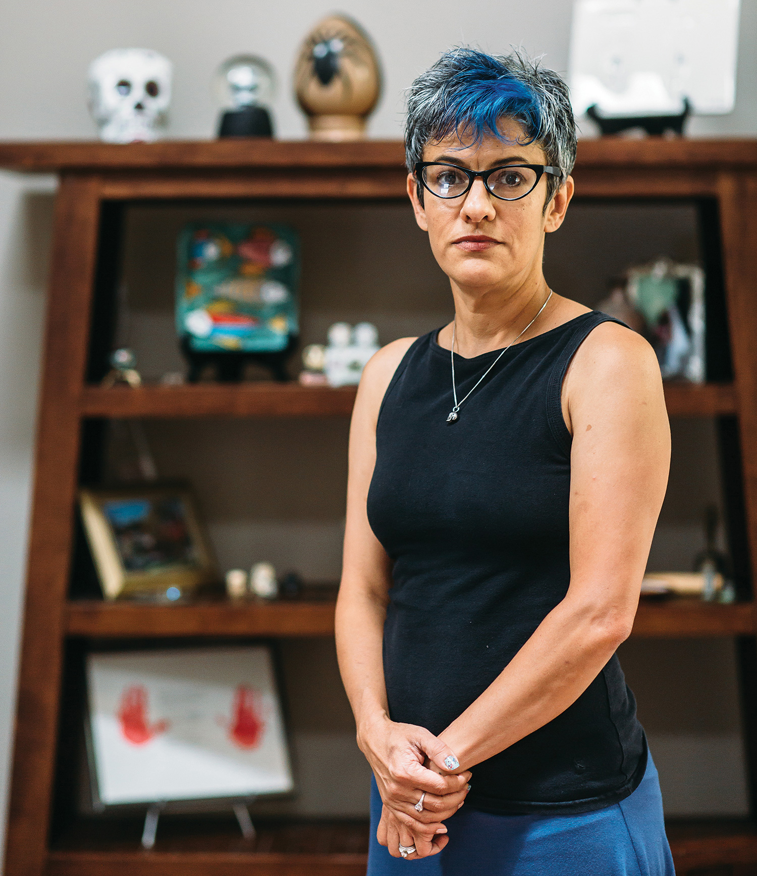 “I even had spiders on my wedding invitations,” reveals Lisa Swain of Hendersonville, who collects Day of the Dead memorabilia and other spooky accessories all year long. Photo by Tim Robison