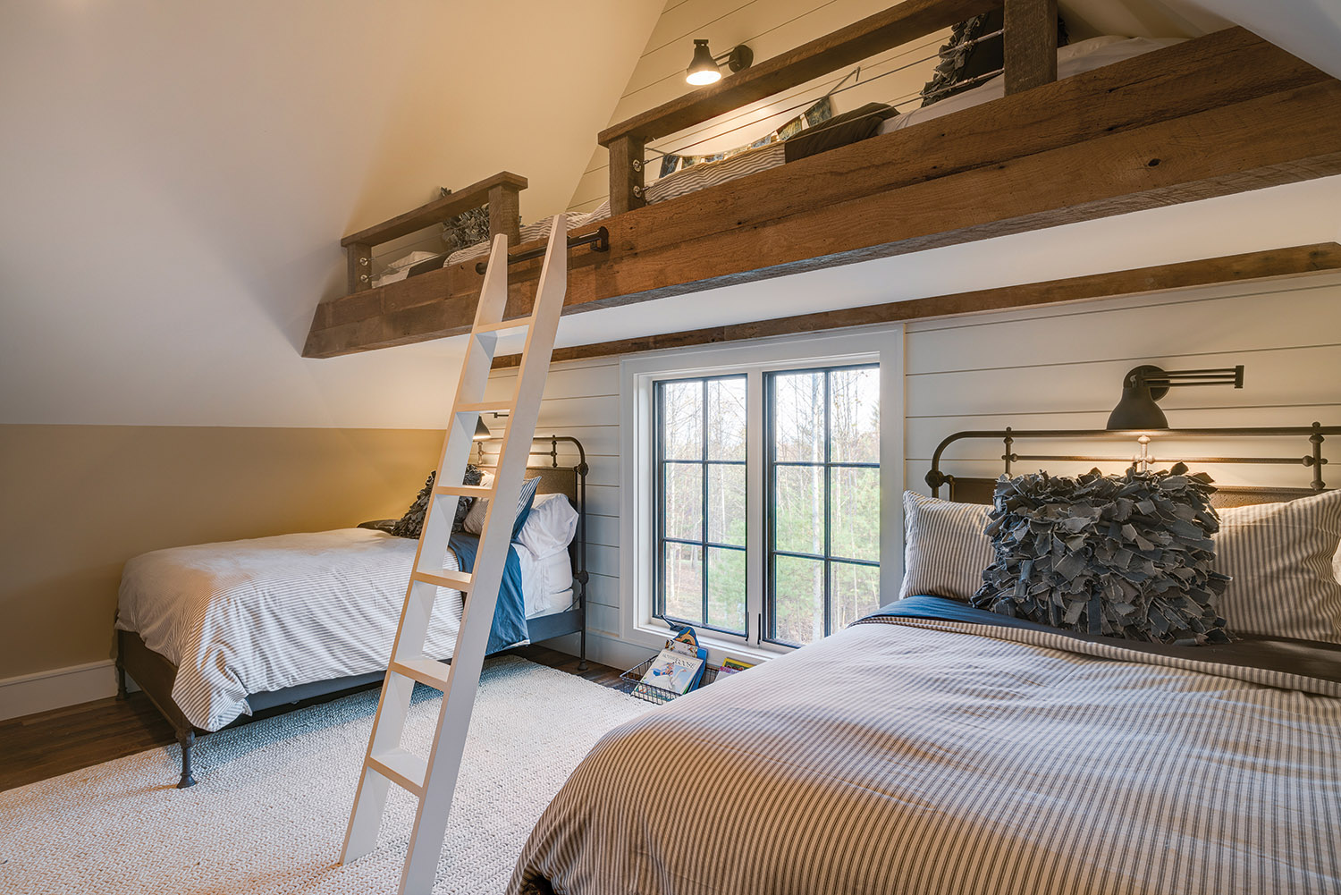 In the bedroom, stylish steel-frame beds are from Restoration Hardware. Photo by Kevin Meechan
