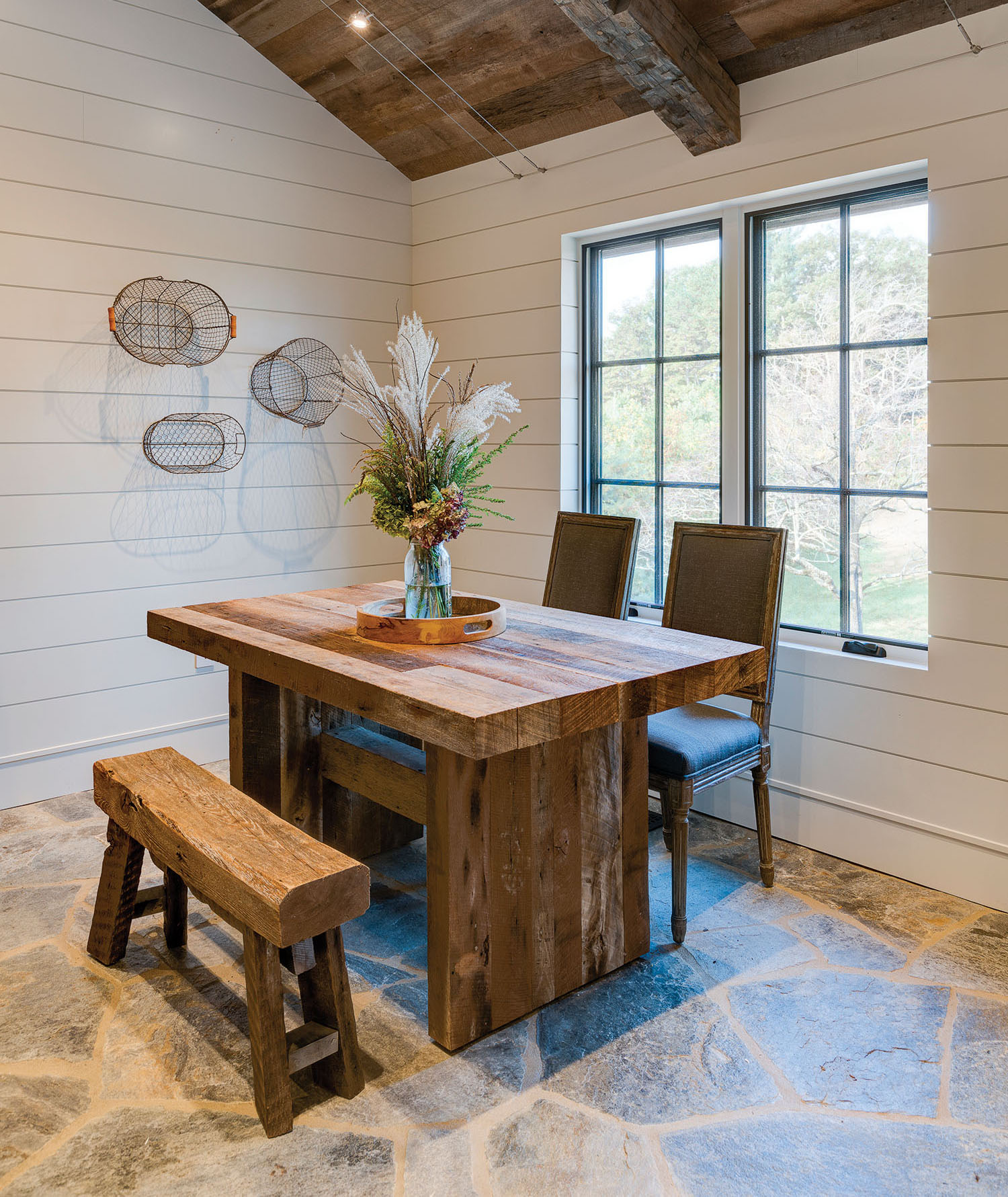 The handcrafted dining table is by Chad Corey Construction. Photo by Kevin Meechan