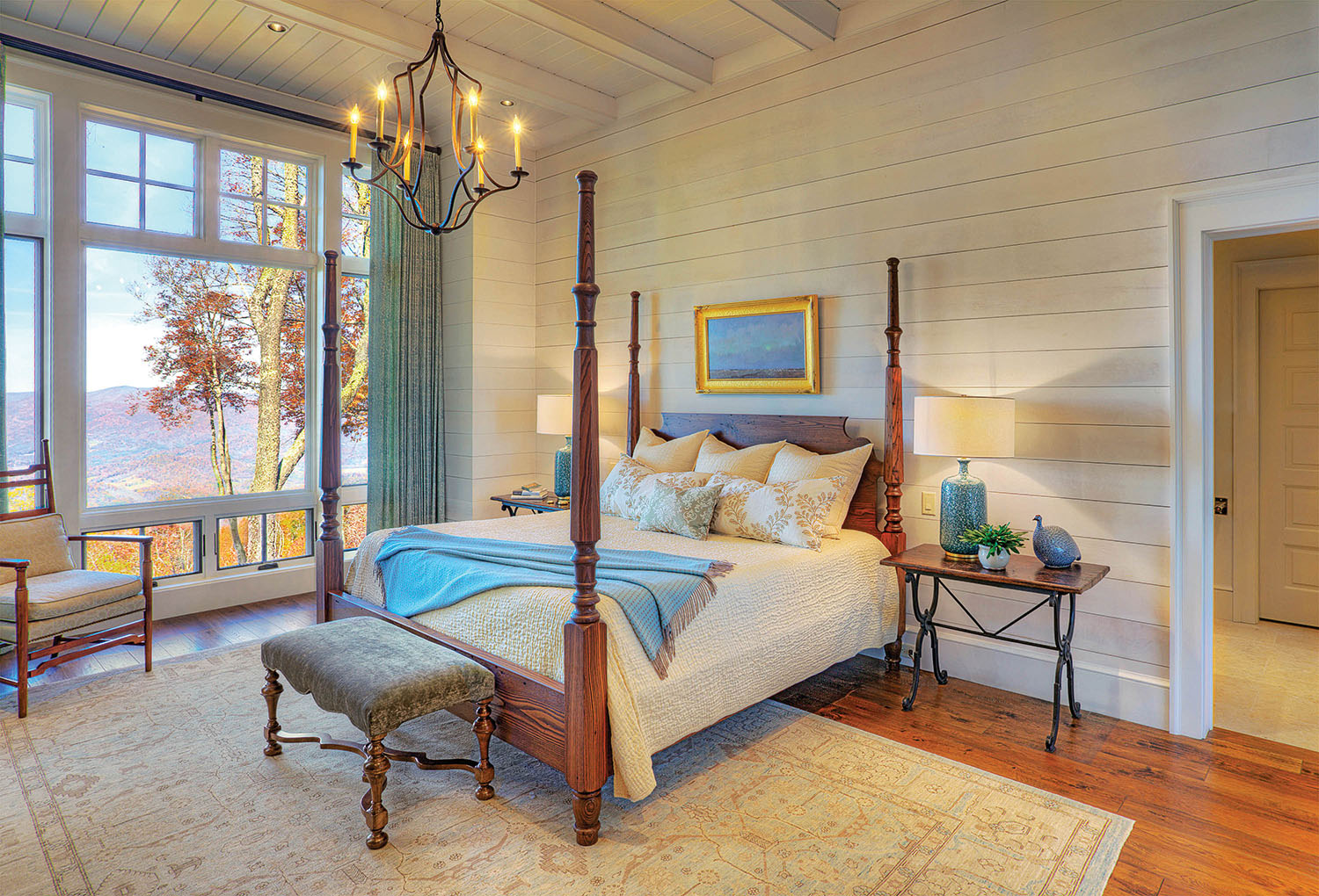 The four-poster bed in the master bedroom is custom made. The drapery fabric is Kerry Joyce Textiles through Ambiance Interiors. Rug is from Togar. Photo by Jerry Markatos 