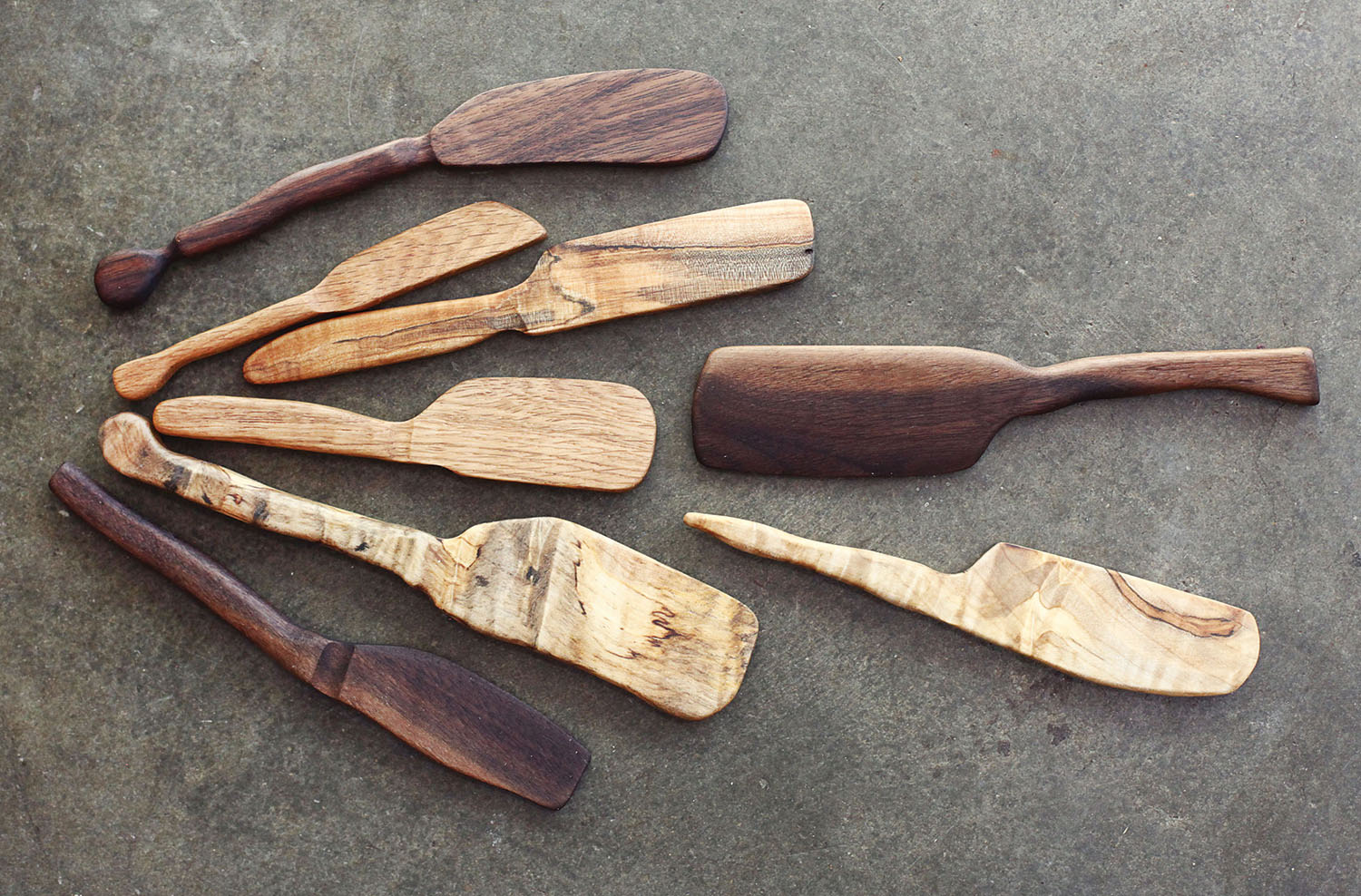 Koli Fisher’s handcrafted boards and cutlery are safe from imitation. Photo by Jen CK Jacobs